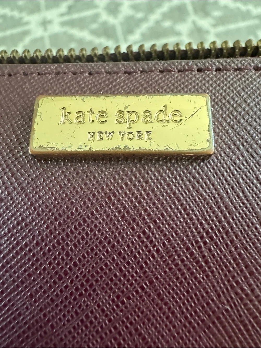 kate spade Plum Textured Leather Wallet with Gold Accent